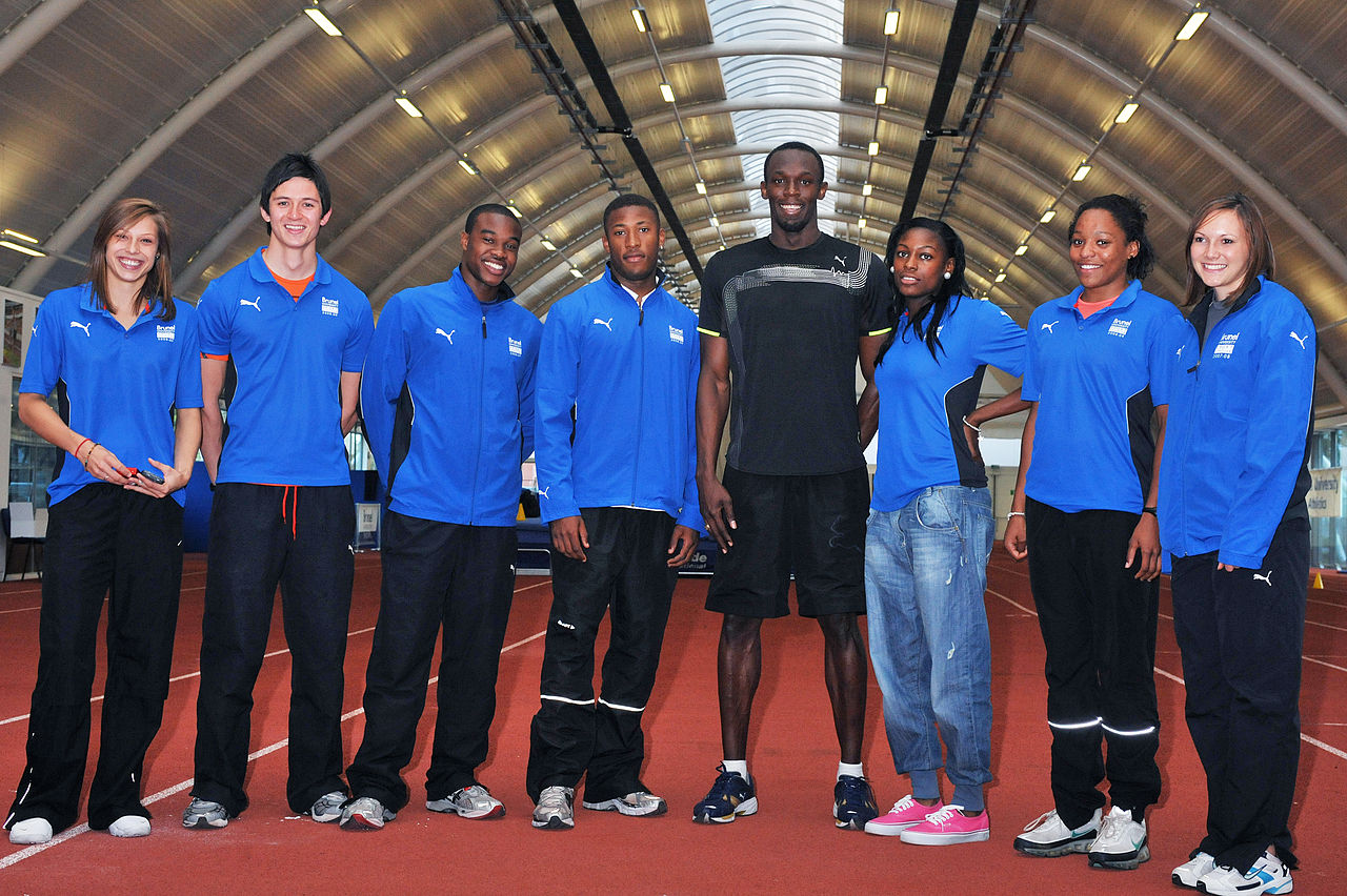 Usain Bolt pictured with seven of Brunel's student athletes